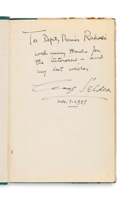 an open book with a handwritten note on the cover