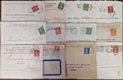 several old envelopes are stacked on top of each other on a table
