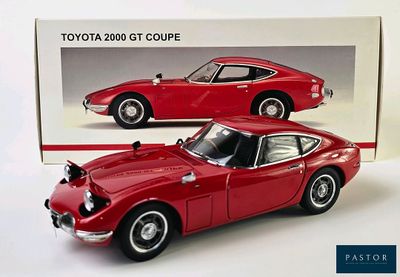 a picture of a red toyota 2000 gt coupe model