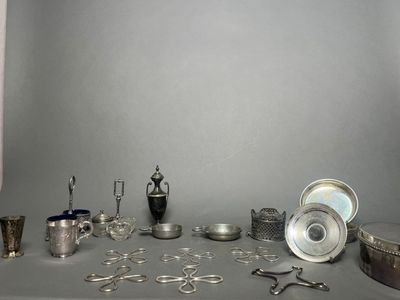 a table with a lot of silver items on it