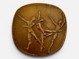 an image of a bronze plaque depicting two dancers on a white background