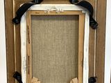 a picture of a picture frame with a picture hanging on it