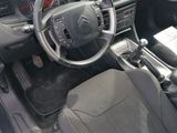 a picture of a car dashboard with a steering wheel in it