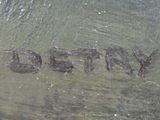 a close up of a metal object with writing on it