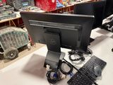 a computer monitor and keyboard on a desk in a store