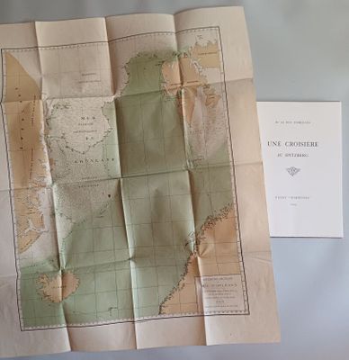 a map on a table with a piece of paper next to it
