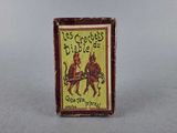 an old matchbox with a picture of two men on horseback