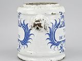 a blue and white vase with a skull on it