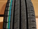a close up of a tire on a cardboard box with a box in the background