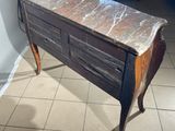 a marble top table with a drawer underneath it