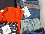 a pile of clothing that is sitting on a table