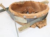 a baseball mitt and a pair of scissors on a table