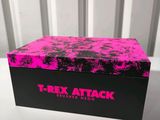 a close up of a box on a table with a pink background