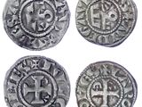 quatre pièces d'argent ornées d'une croix au recto et d'une croix au verso