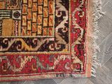a close up of a rug on a wooden floor