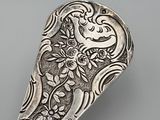 a close up of a spoon with a design on it