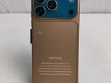 a close up of a cell phone with a warning sign on it
