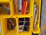 a yellow tool box filled with tools and other items