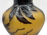 a vase that has a black and yellow design on it