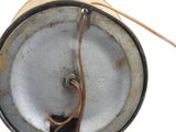 a close up of a metal object with a wire in it