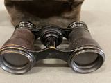 an old pair of binoculars sitting on top of a table