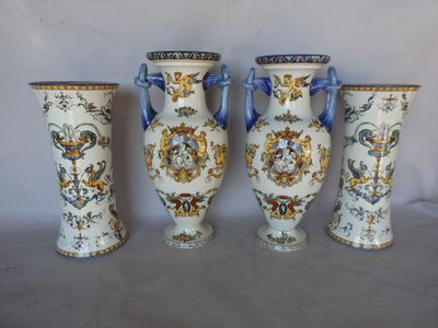 three vases with handles and handles are lined up against a white background