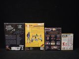 three boxes of action figures on a black surface