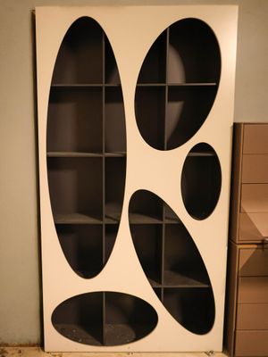 a picture of a bookcase with a black and white design on it