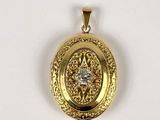 an image of a gold locke with a diamond in the center