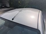 a car that has a antenna on the top of it
