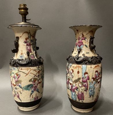 two vases that are sitting on a table