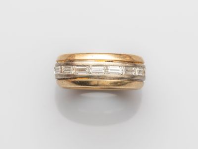 an 18k gold and diamond band ring