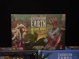 three board games sitting on top of a table next to each other
