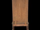 an old wooden cabinet with a mirror on top of it