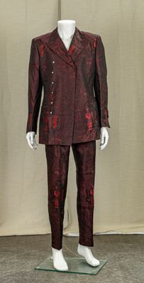 a mannequin dressed in a suit and tie on display