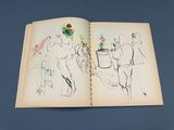 an open book with a drawing of a man and a woman on it