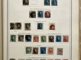 an open book with a bunch of different stamps on it