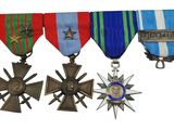 three medals and a star on a white background