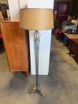 a lamp that is sitting on a stand in a room
