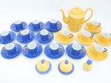 yellow and blue tea set on a white background