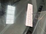 a sticker on the back of an escalator that says you pay