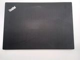 a black mouse pad with a white sticker on it
