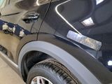 a close up of a car ' s door handle with a sticker on it