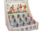a display of tins with a picture of people on them