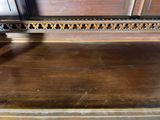 a wooden bench that has been cleaned and is sitting on the floor