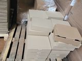 a pile of boxes sitting on a pallet in a warehouse