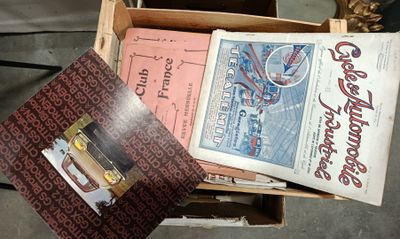 a lot of books in a box on the floor