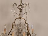 a close up of a chandelier hanging from a ceiling