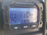 a close up of a digital clock on the dashboard of a motorcycle