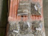 many different types of straws and bags on the floor
